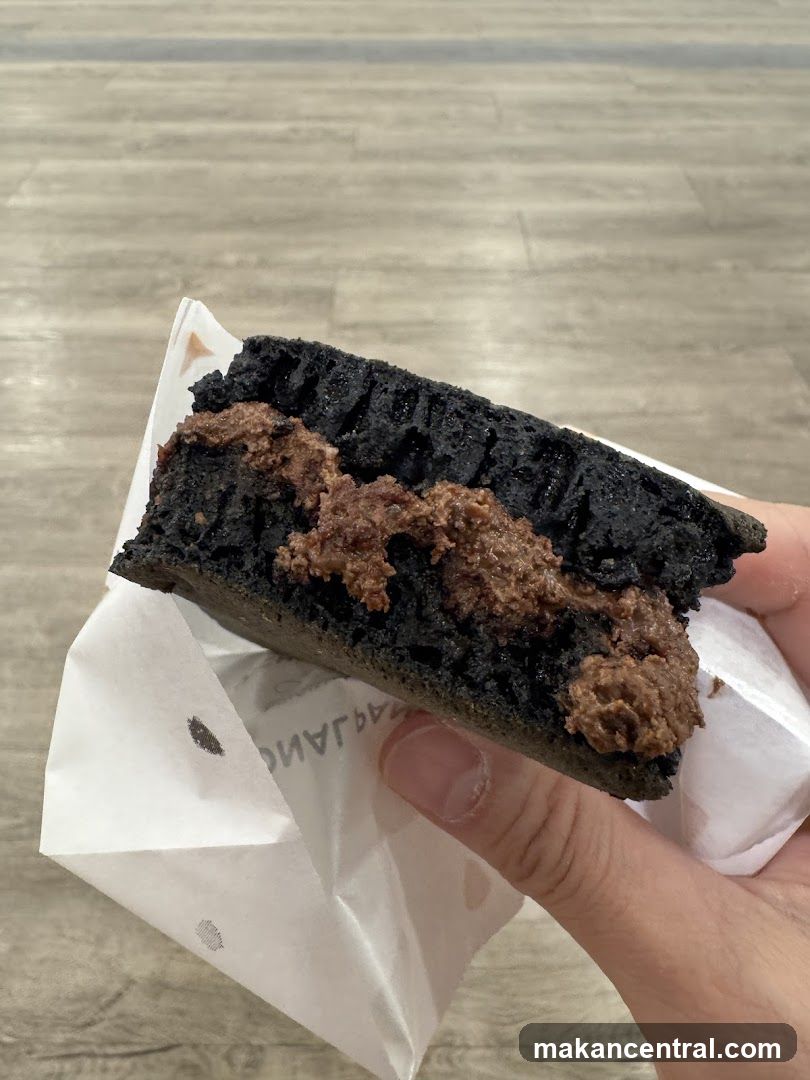 Black waffle sandwich with chocolate filling