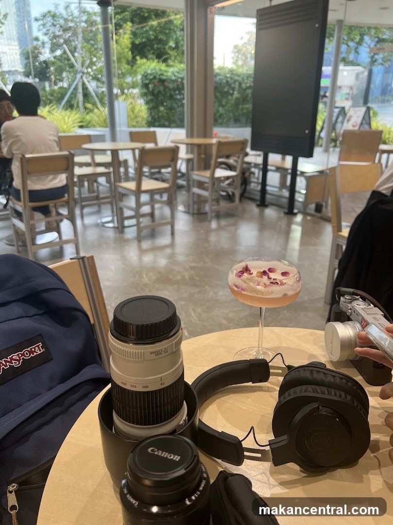 Cafe Interior with Drink and Photography Gear