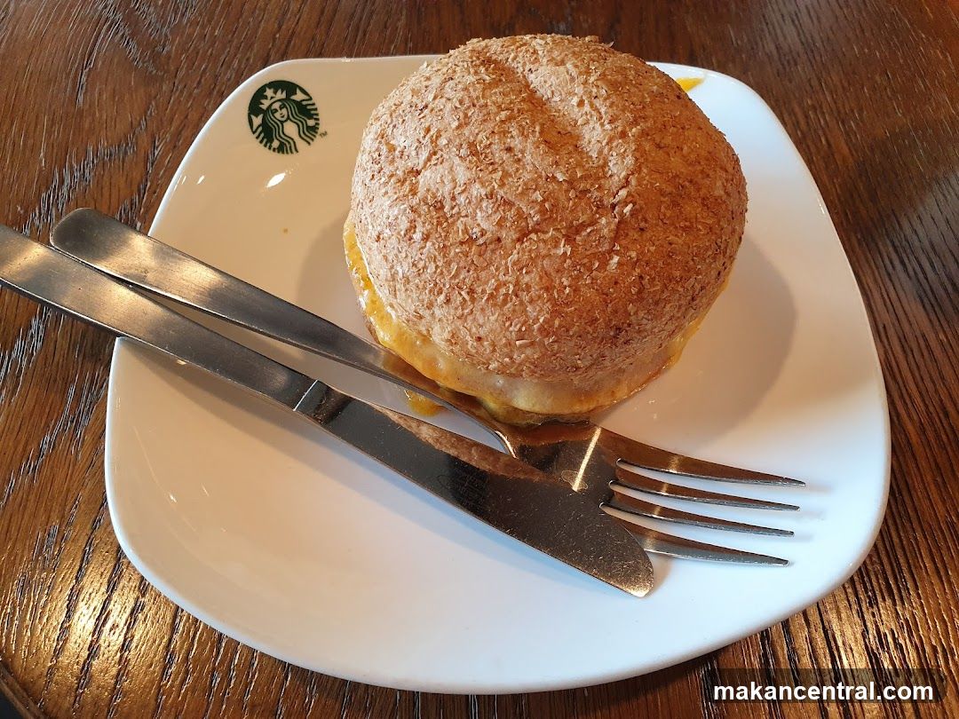 Sandwich on a plate with cutlery