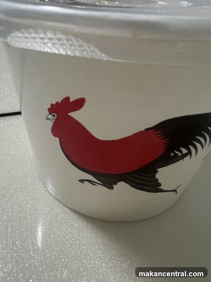 White bucket with rooster illustration