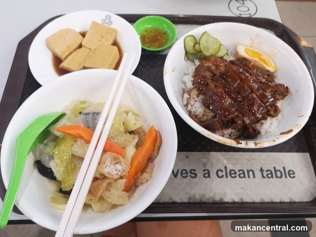 Tray of food with rice, vegetables, and tofu