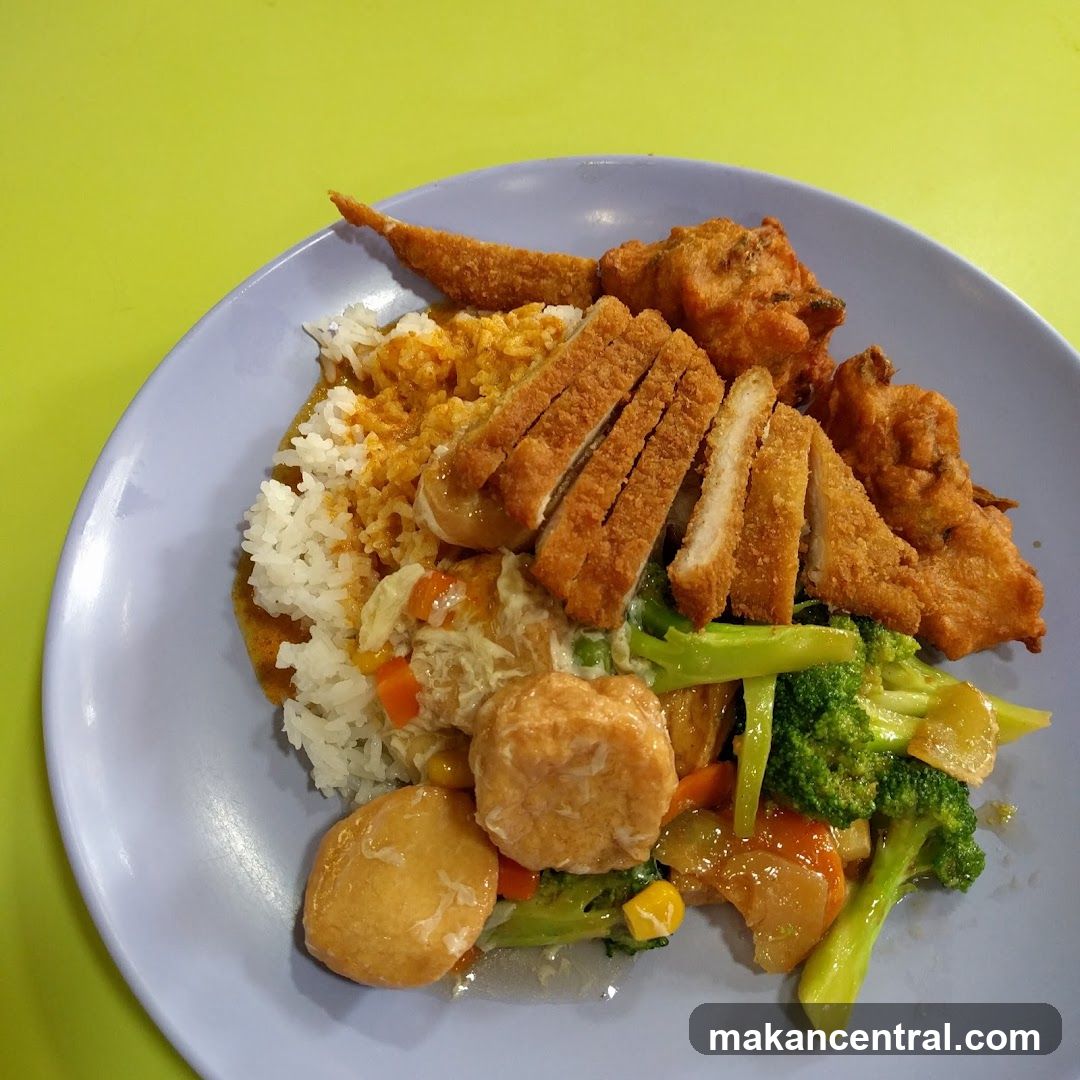 Plate of food with rice and various toppings