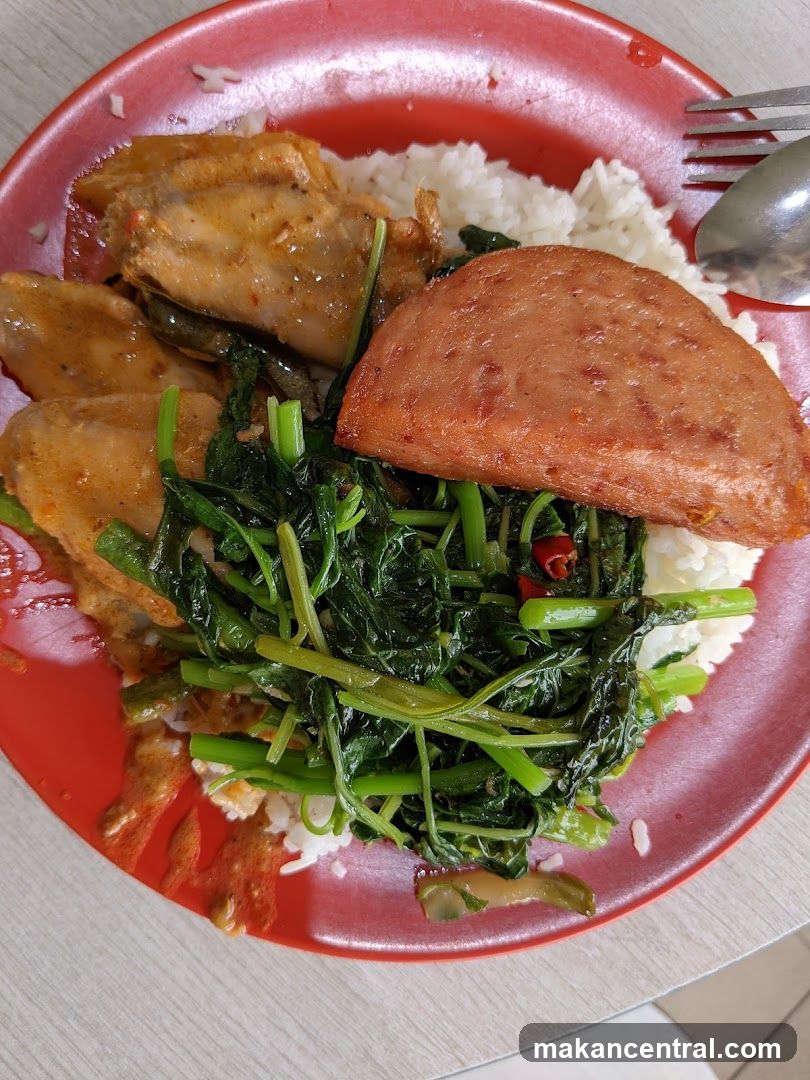 Rice plate with chicken, vegetables, and luncheon meat
