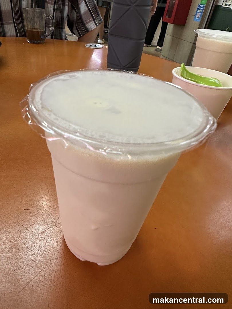 White Drink in a Plastic Cup