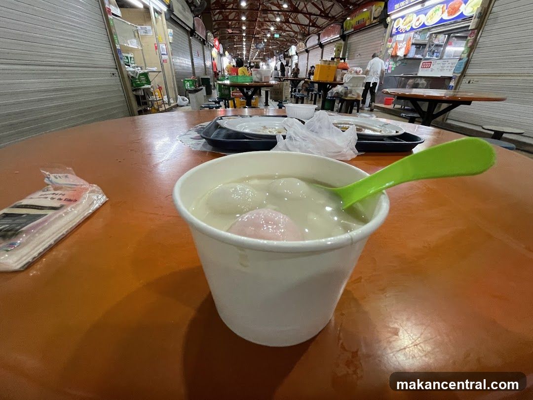 Dessert in a cup with a green spoon