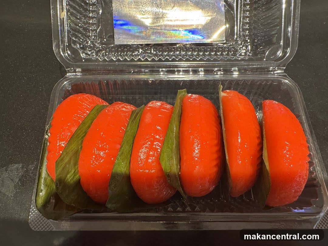 Red Kuih Lapis in a Plastic Container