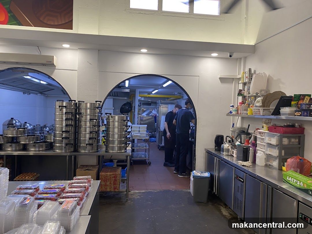 Kitchen interior with stacked steamers and food containers