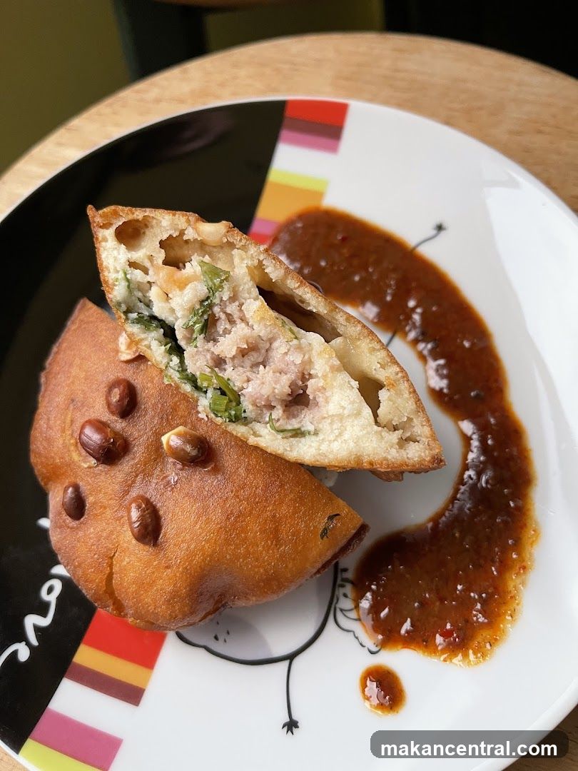 Fried Pastry with Filling and Sauce