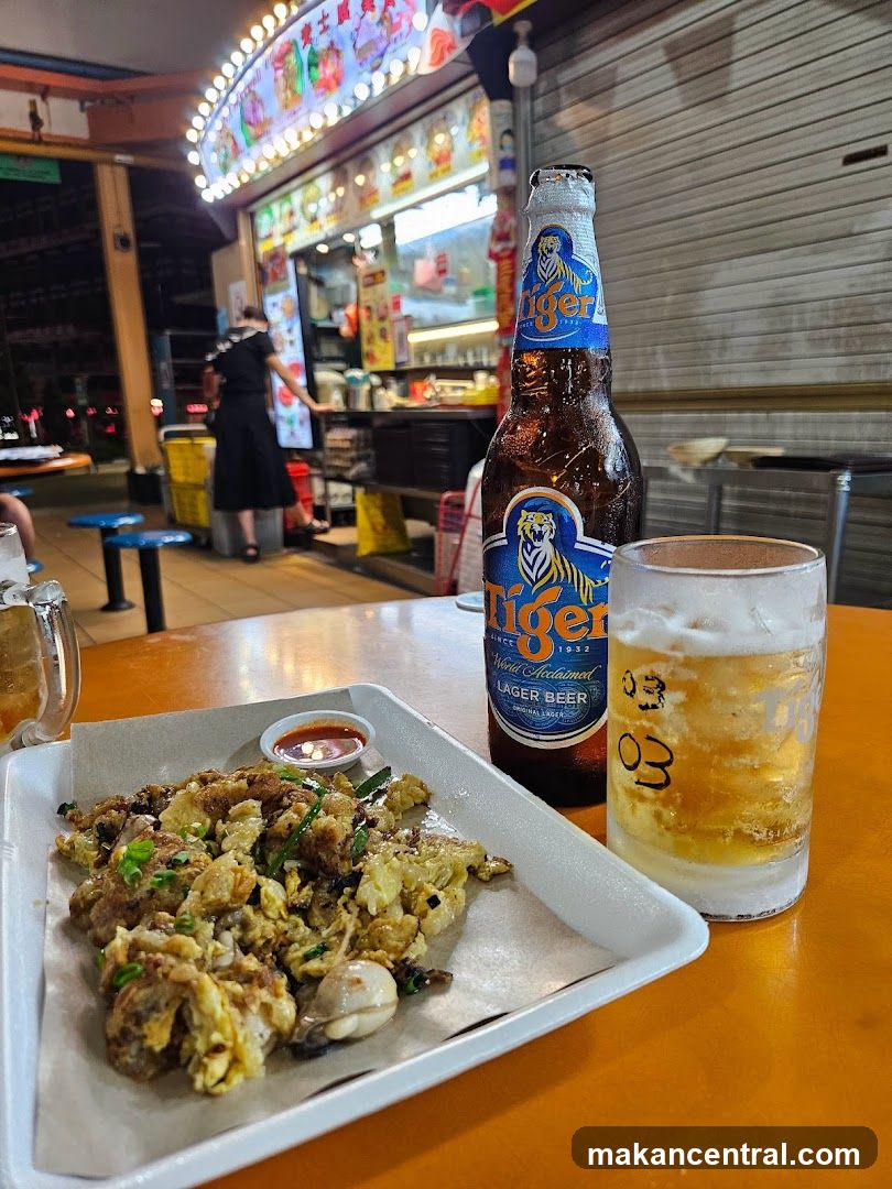 Oyster omelet and beer at a food stall