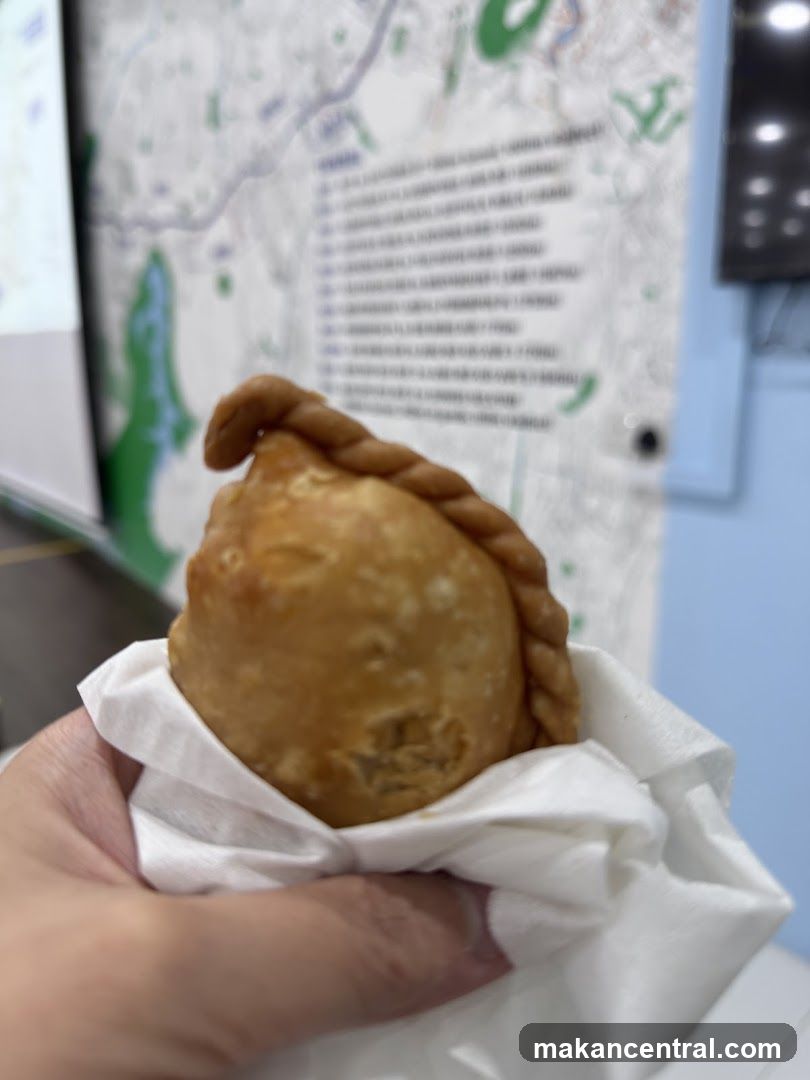 Hand holding a pastry