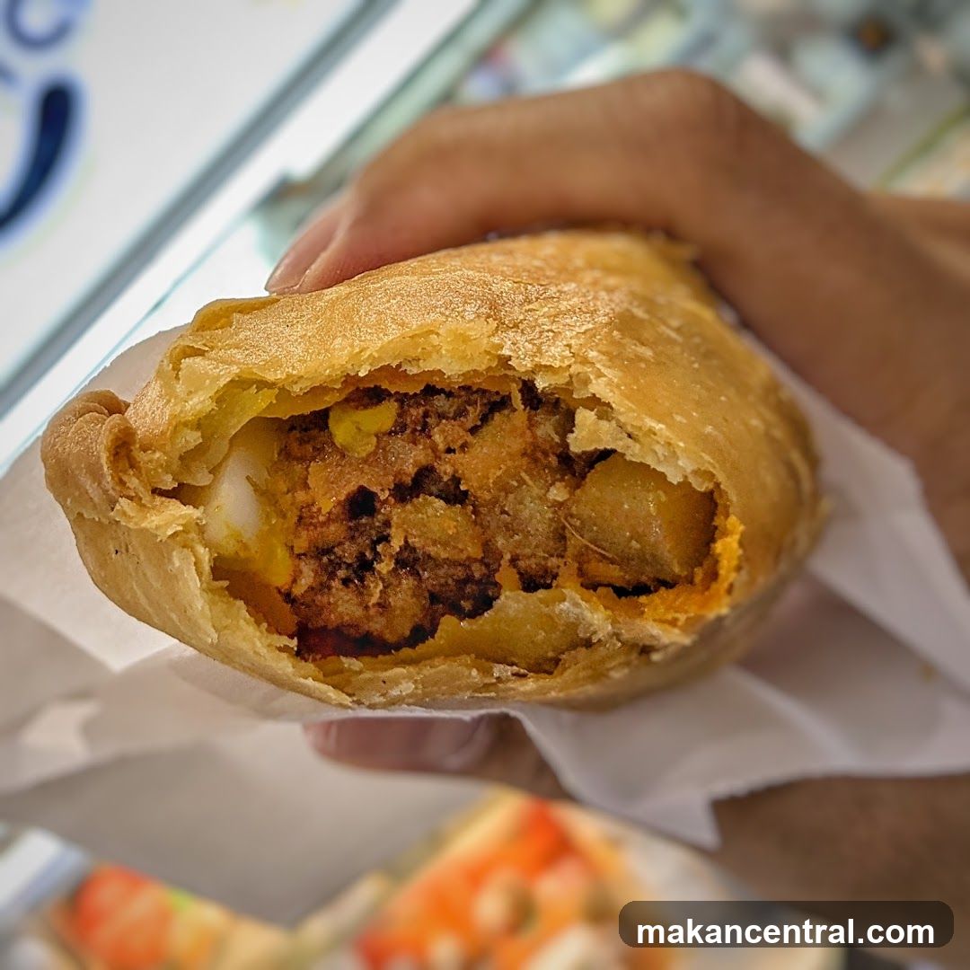 Hand holding a pastry
