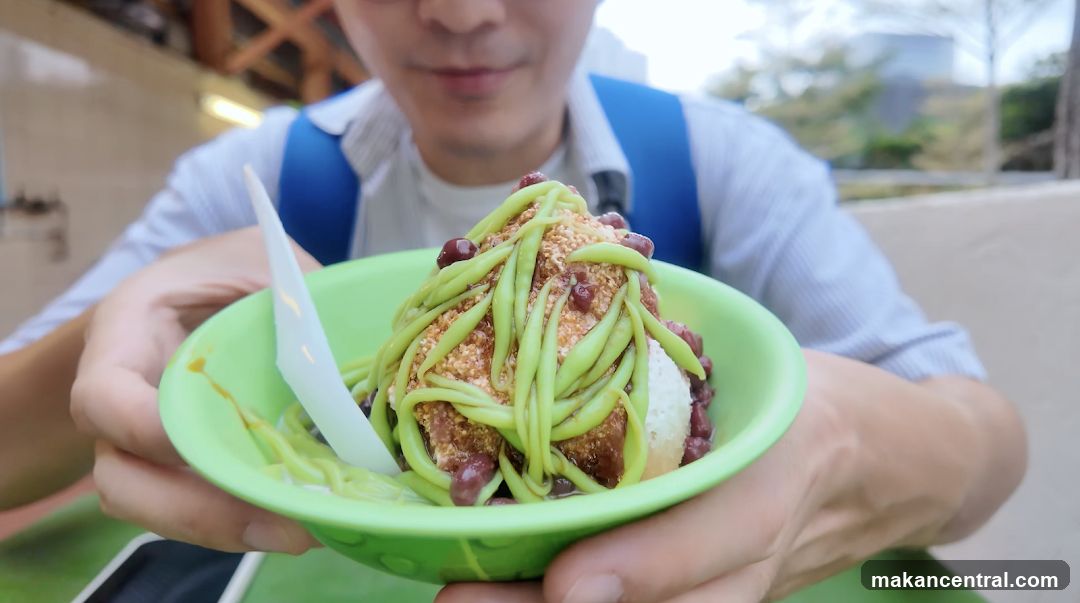 Person holding a bowl of dessert