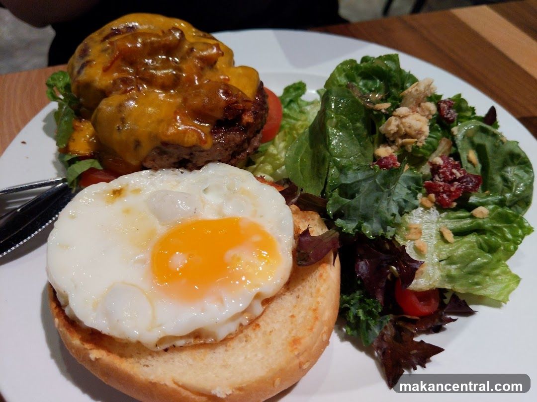 Cheeseburger with Fried Egg and Salad