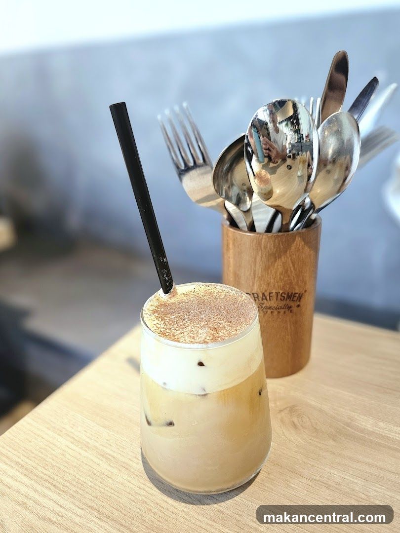 Iced Coffee with Cream and Cocoa Powder