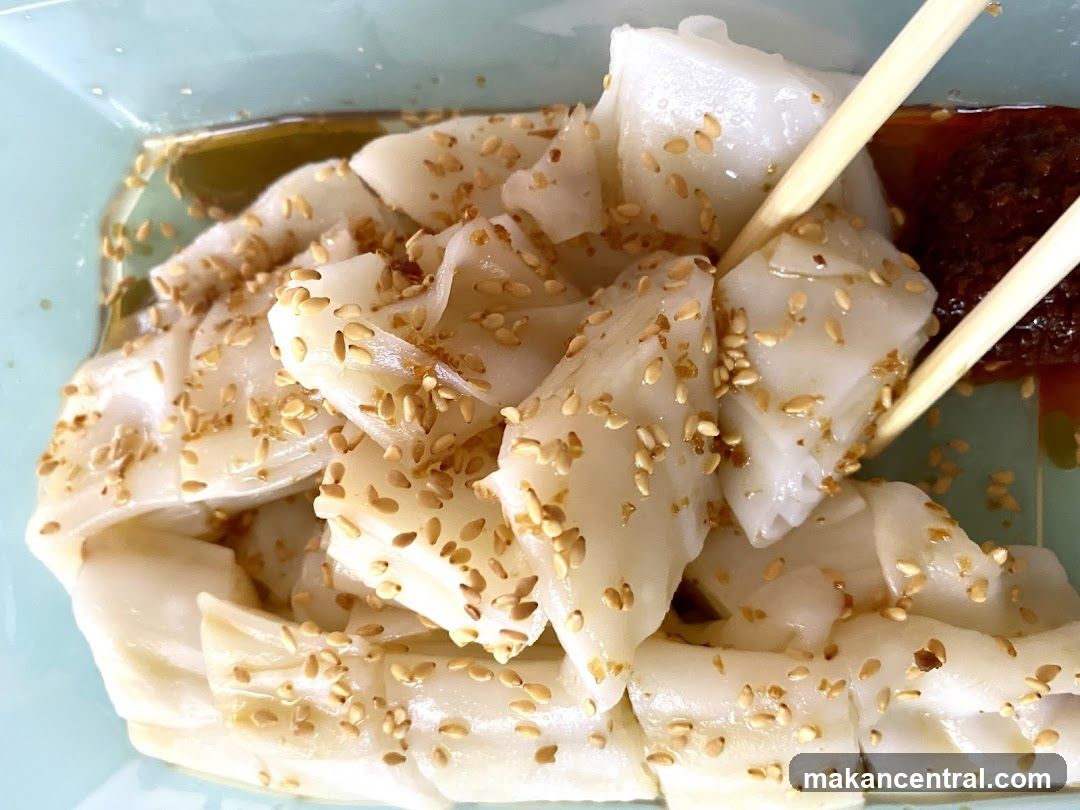 Cheung Fun with Sesame Seeds and Chili Sauce