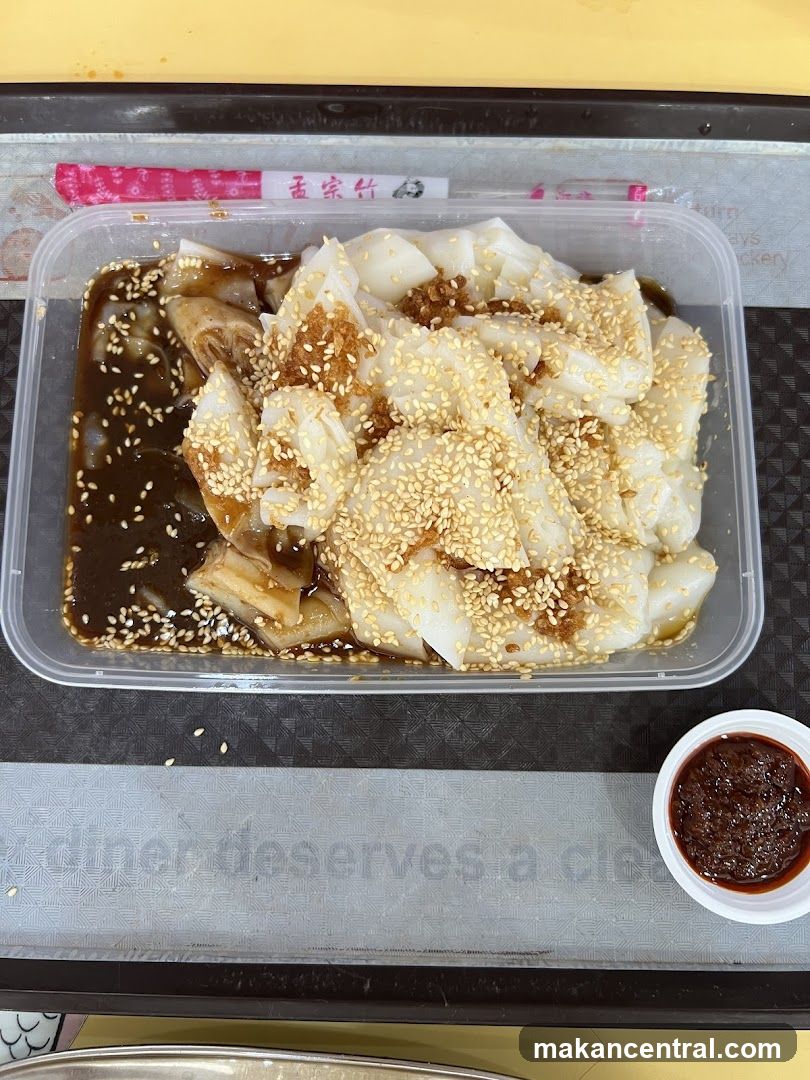 Chee Cheong Fun with Sauce and Sesame Seeds