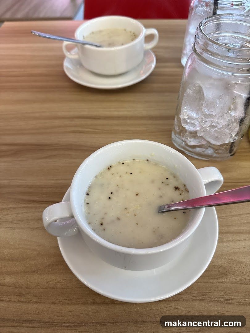 Creamy Soup with Spoons and Drink