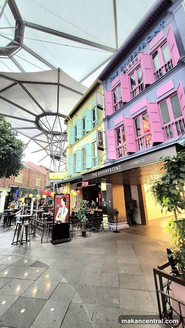 Outdoor seating area with colorful buildings