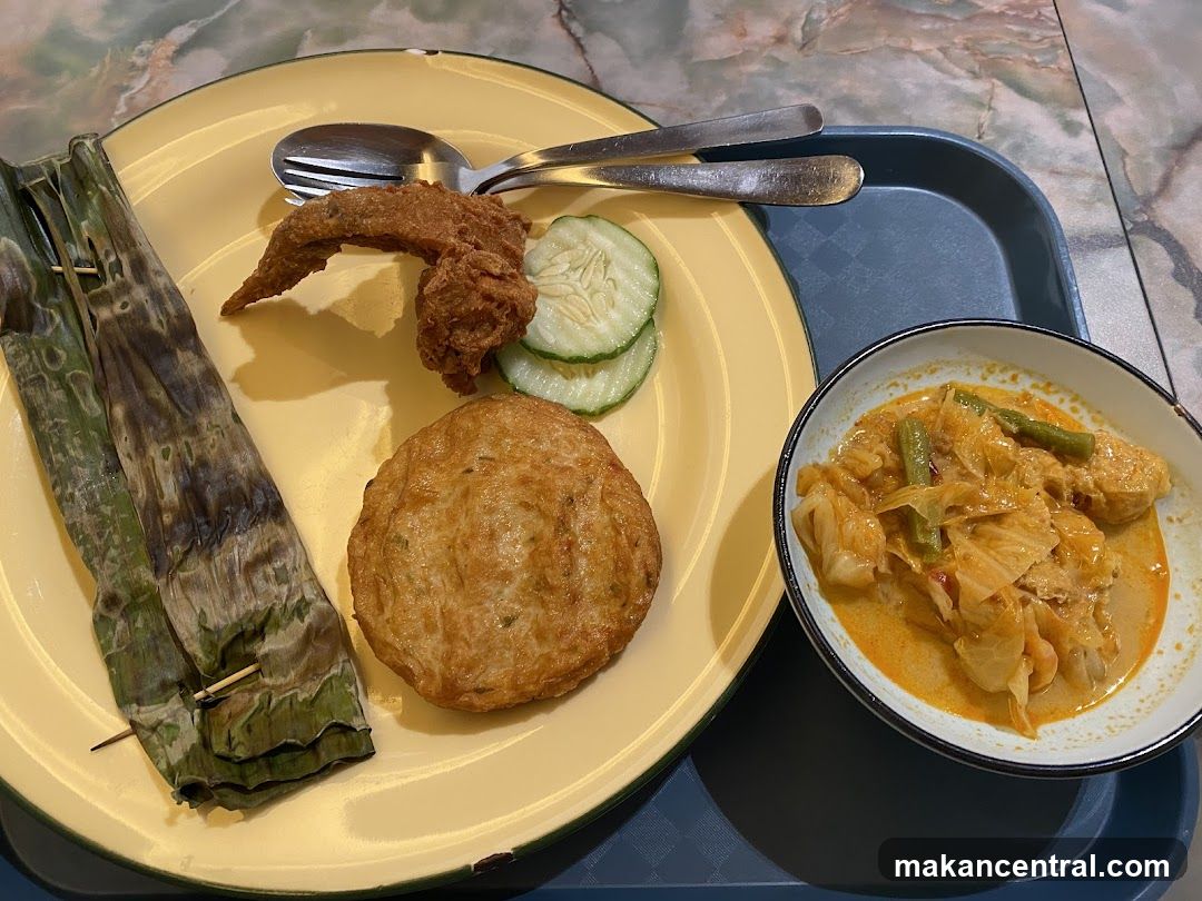 Curry dish with side of fried items