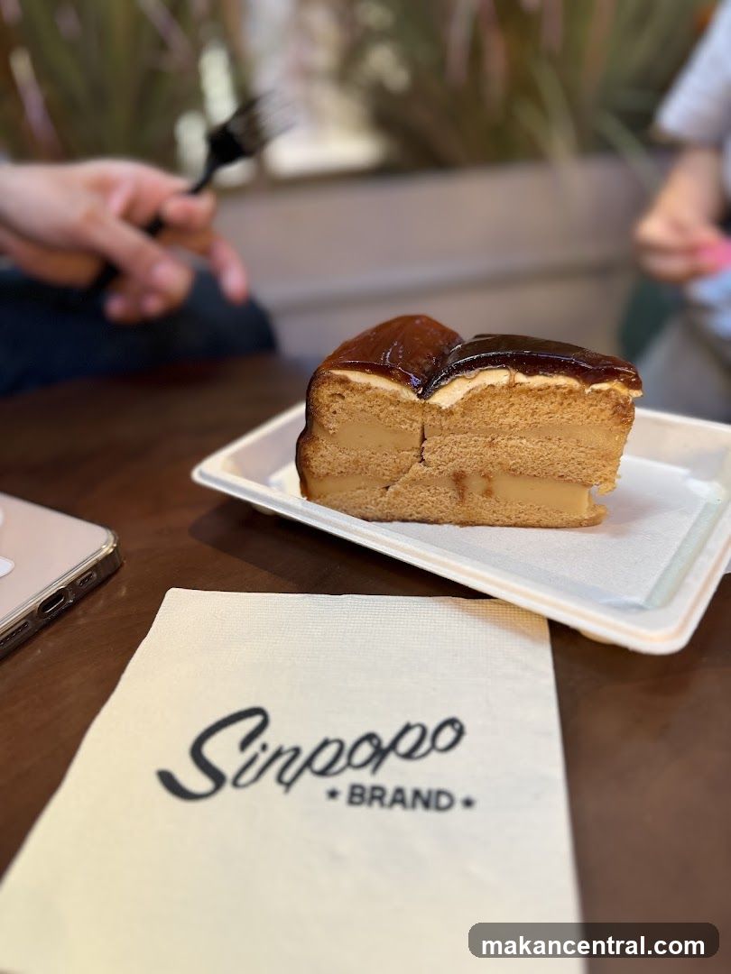 Slice of cake on a plate with a napkin