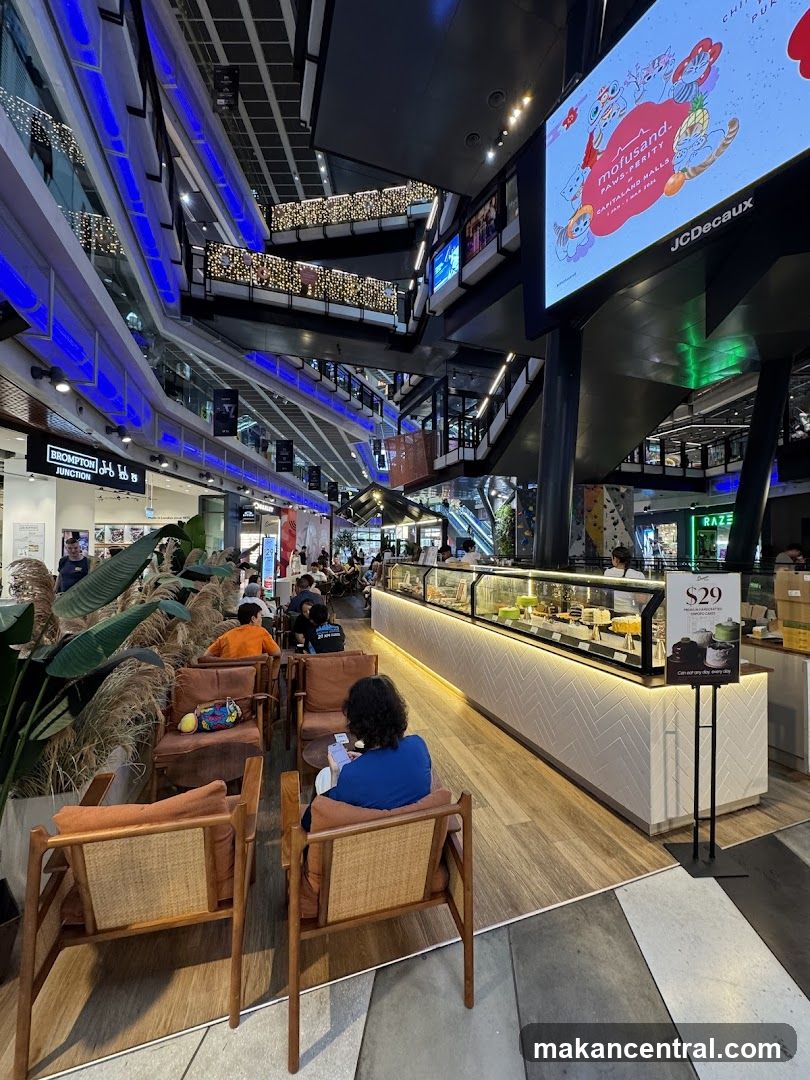 Interior of a modern shopping mall with a cafe