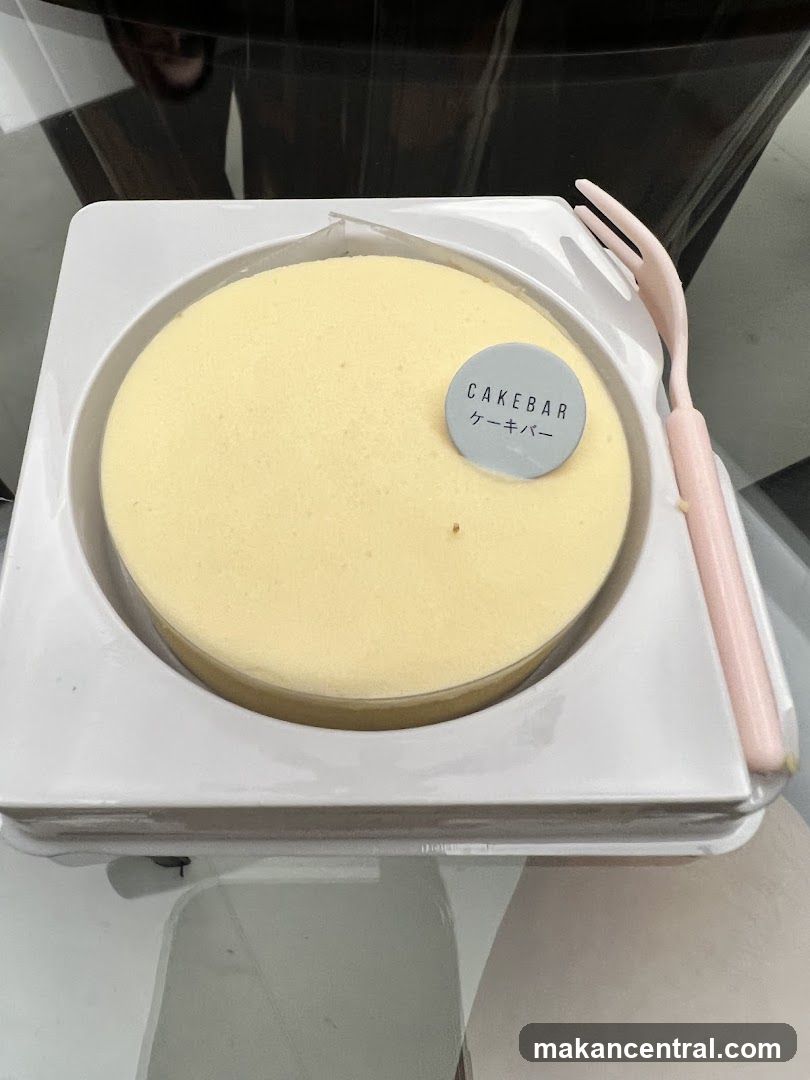 Cheesecake with "CAKEBAR" logo