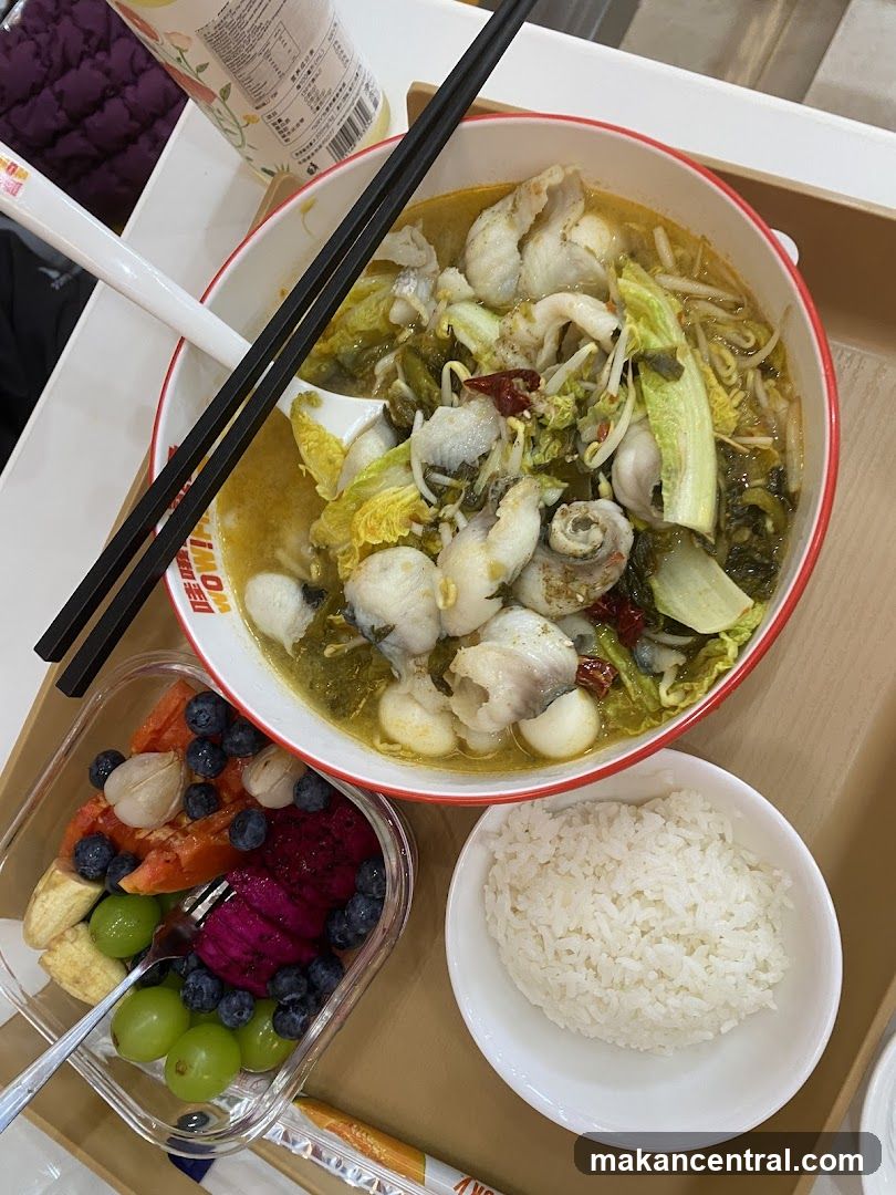 Meal with Fish Soup, Rice, and Fruit Salad
