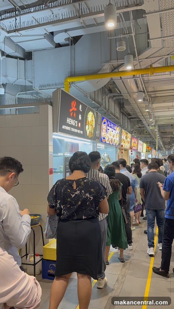 People queuing at a food stall