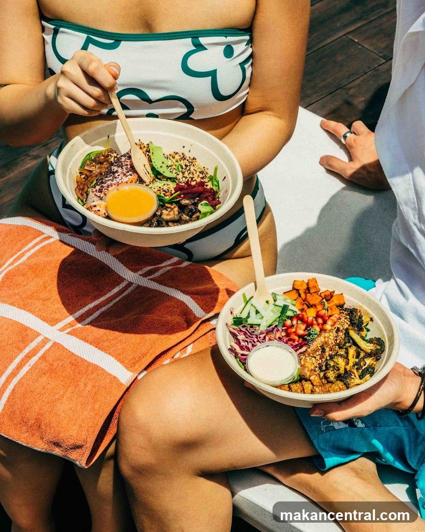 Two people enjoying healthy bowls outdoors