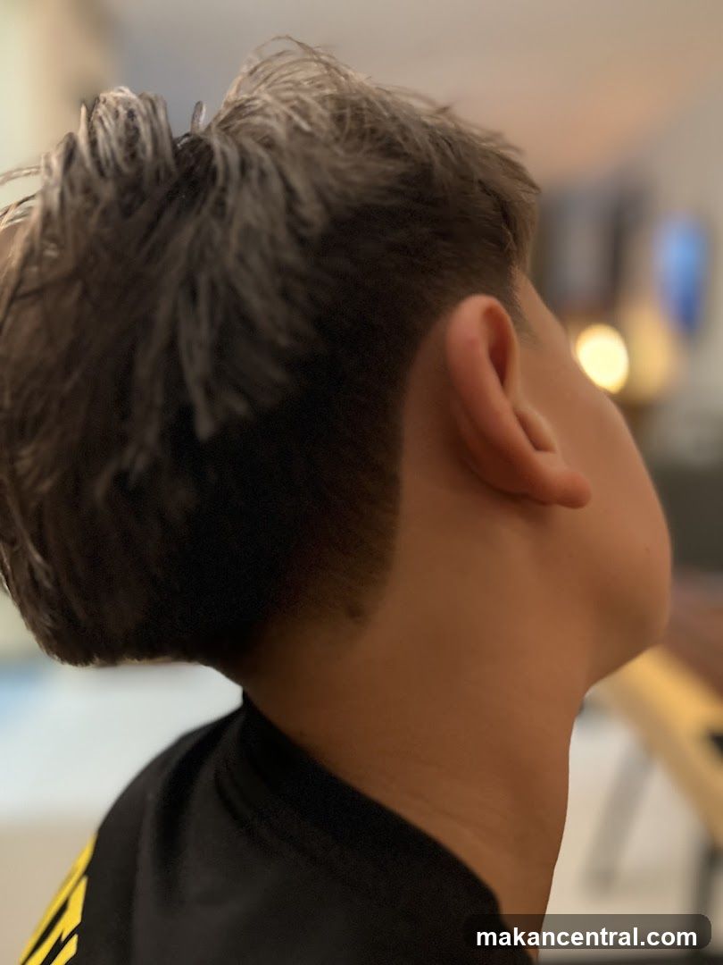 Close-up of a person's haircut