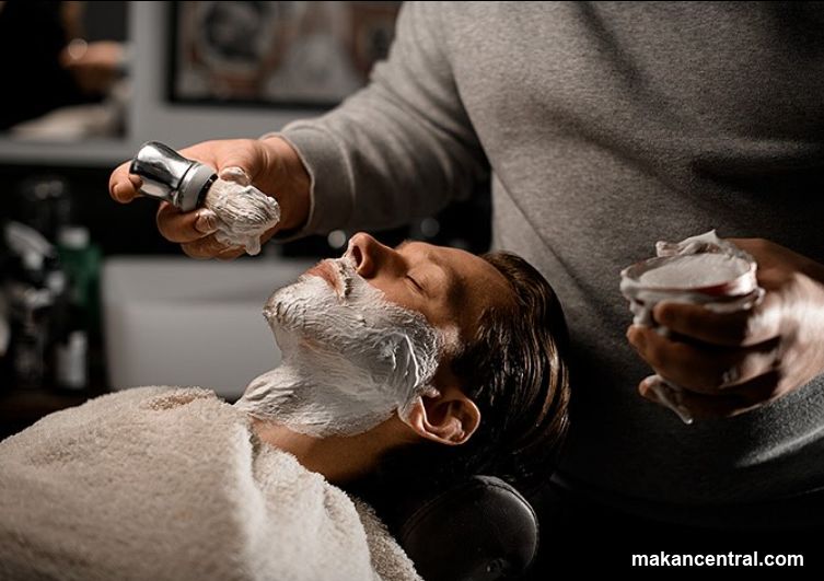 Barber applying shaving cream
