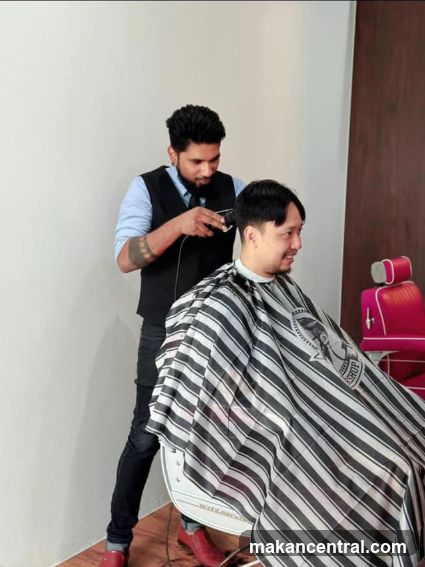 Barber cutting client's hair