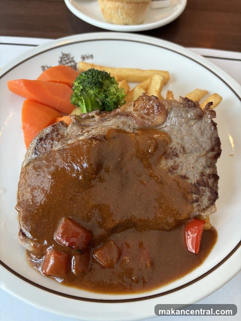 Steak with vegetables and fries
