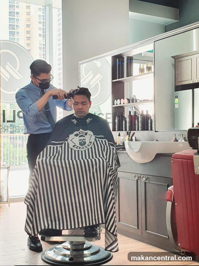 Barber cutting client's hair