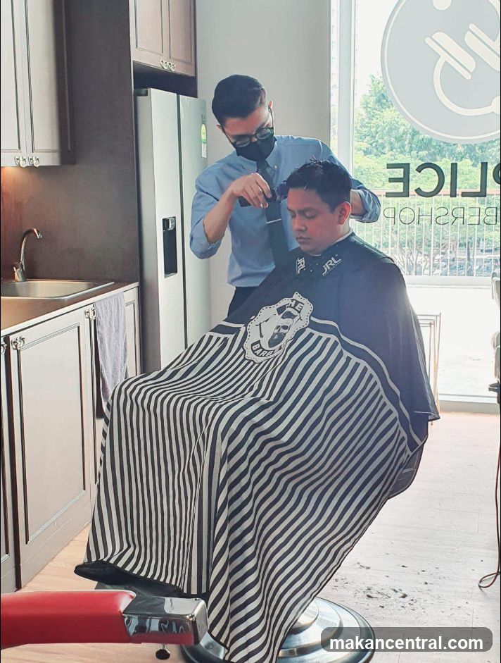 Barber cutting client's hair