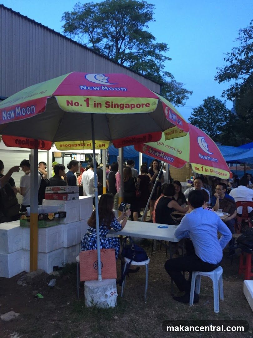 Outdoor gathering with New Moon branding