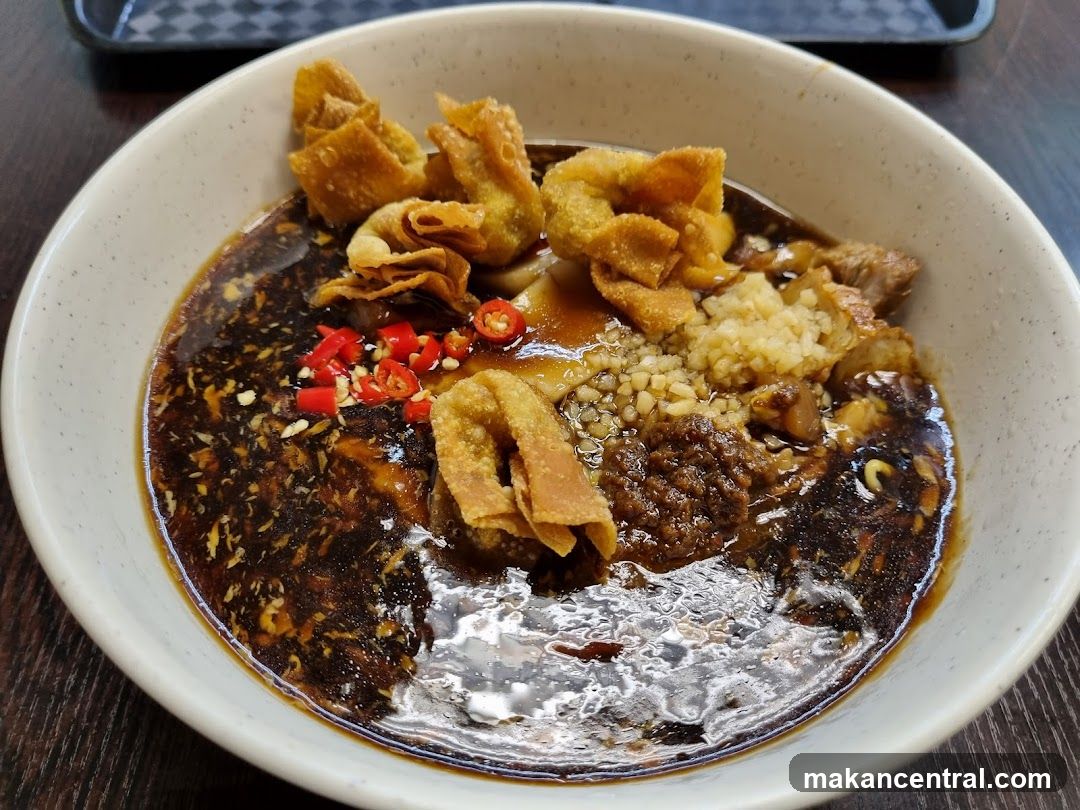 Bowl of Noodles with Wontons and Chili