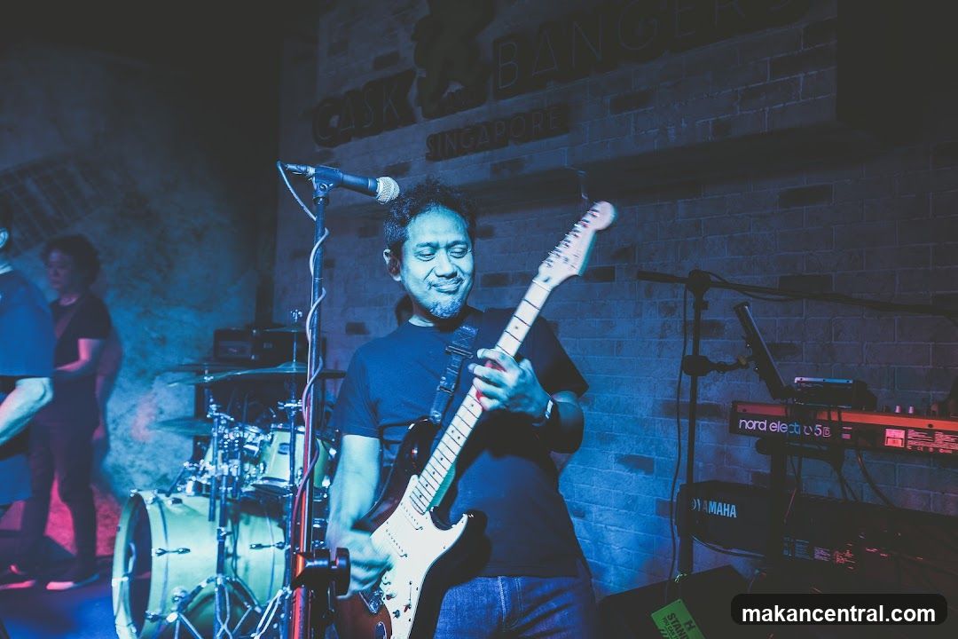 Musician Playing Guitar on Stage