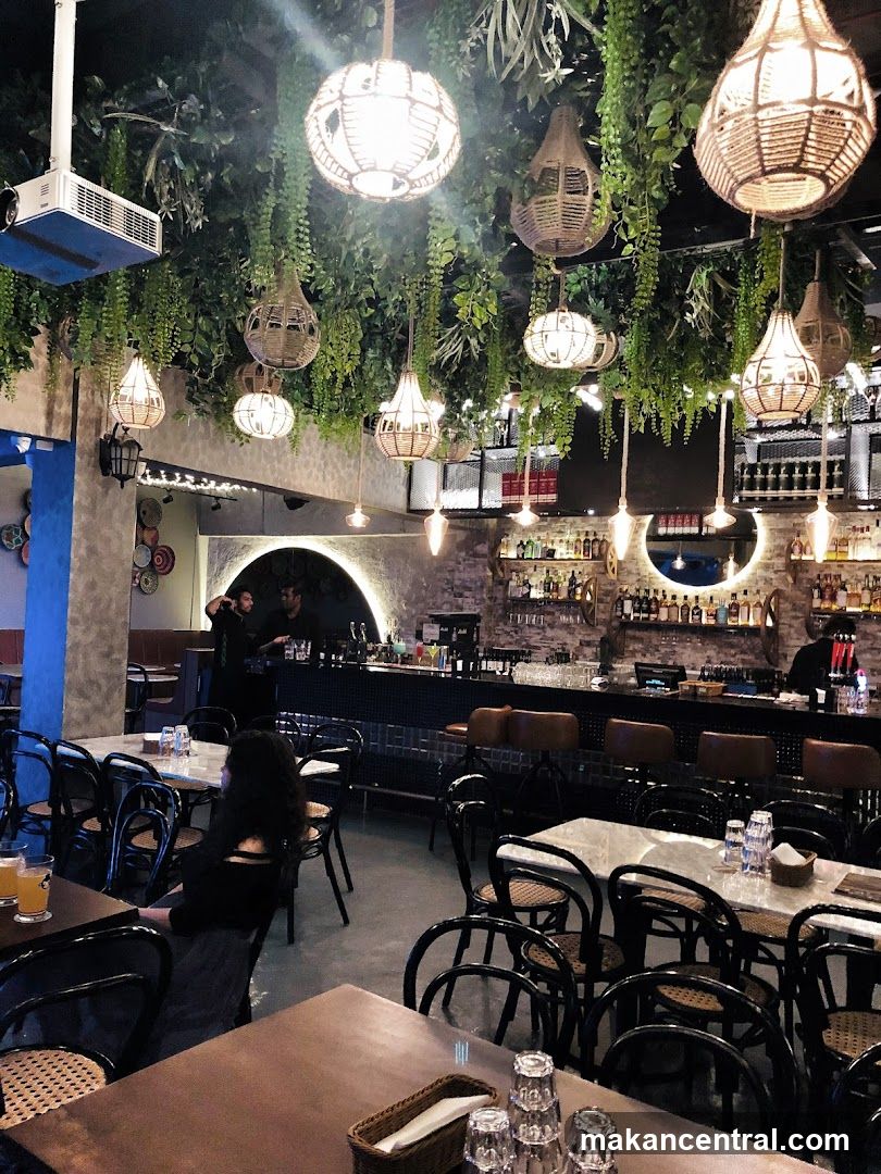 Restaurant Interior with Hanging Plants and Lights