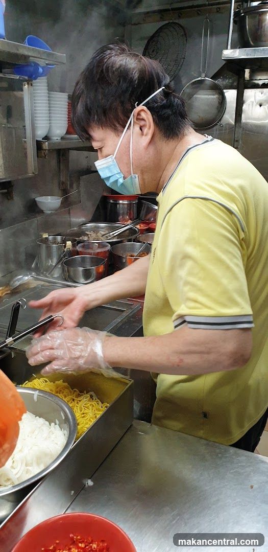Cook preparing noodles