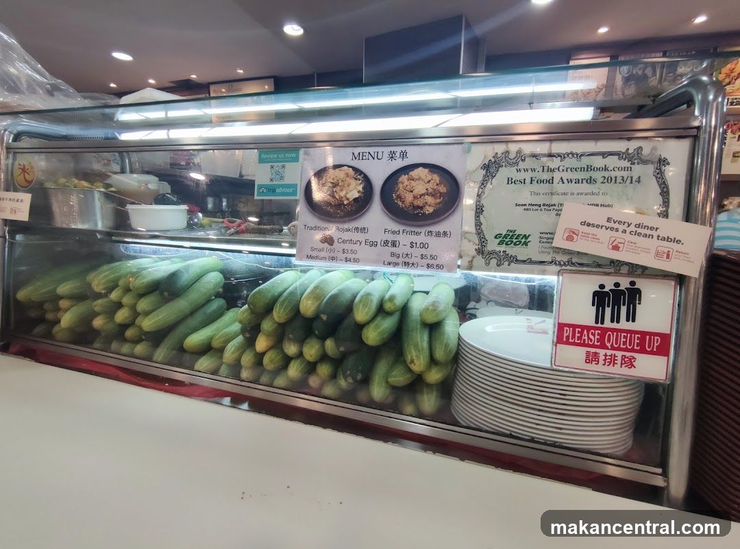 Food stall display with menu and awards