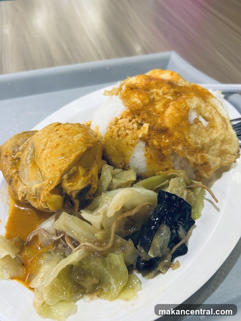 Curry Chicken Rice with Fried Egg and Vegetables