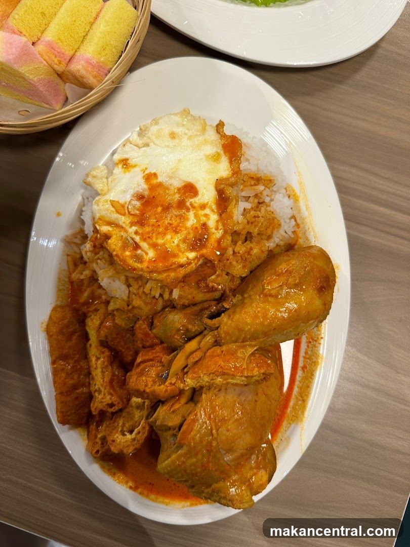 Chicken Curry Rice with Fried Egg and Bread Rolls