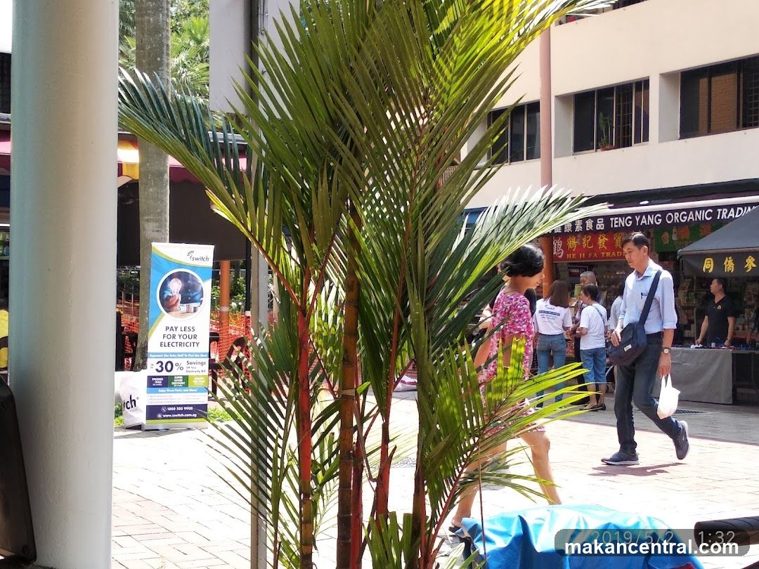 Outdoor market scene with promotional banner