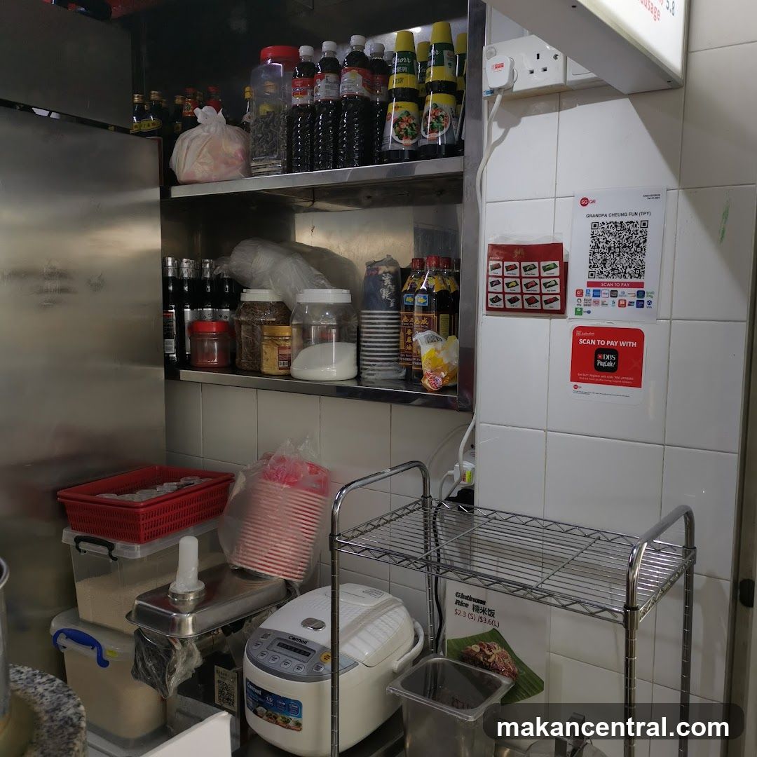 Kitchen Shelving with Food Items and Payment Signs