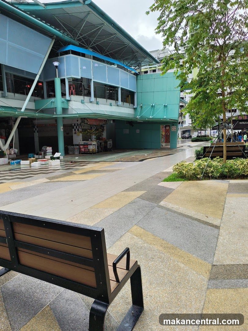 Outdoor seating area with a food stall