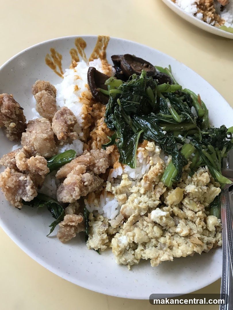 Plate of Rice with Various Toppings
