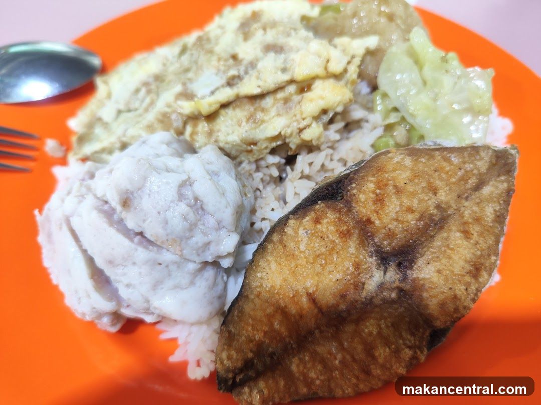 Rice plate with fried fish and other toppings