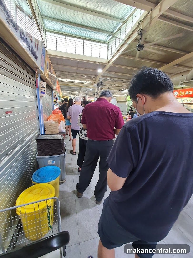 People queuing at a food stall