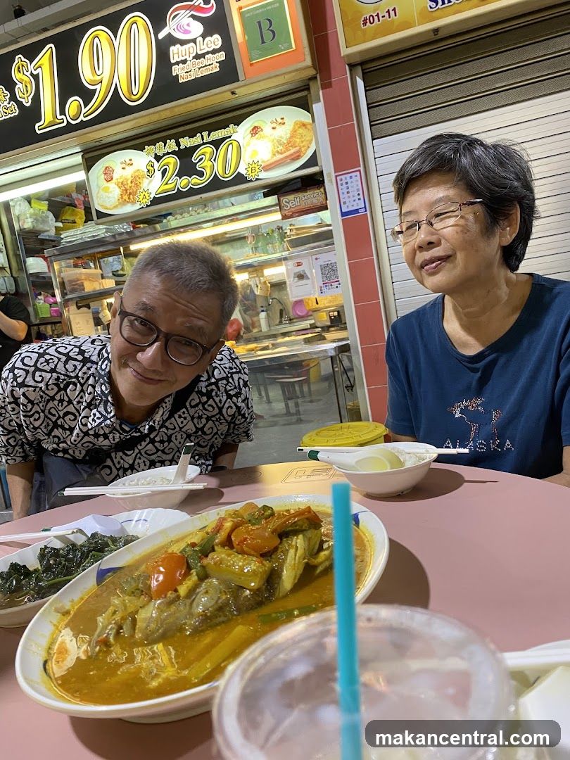 People Eating at a Food Stall